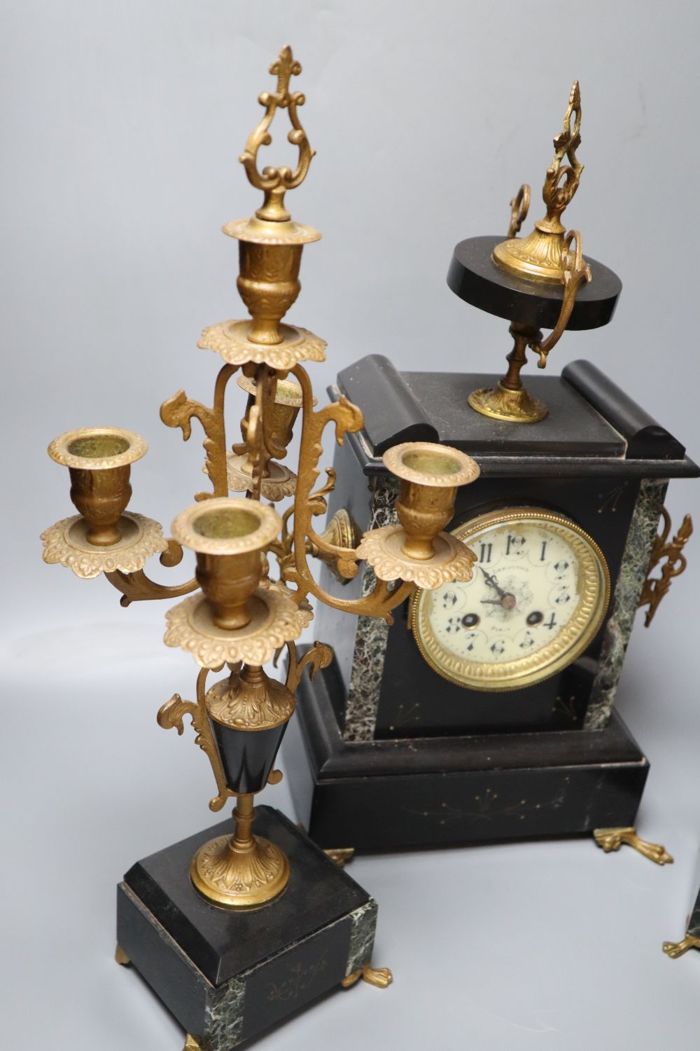 A 19th century black slate clock garniture